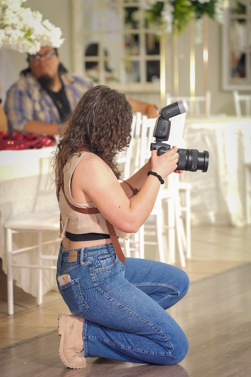 Angela shooting an event with her camera